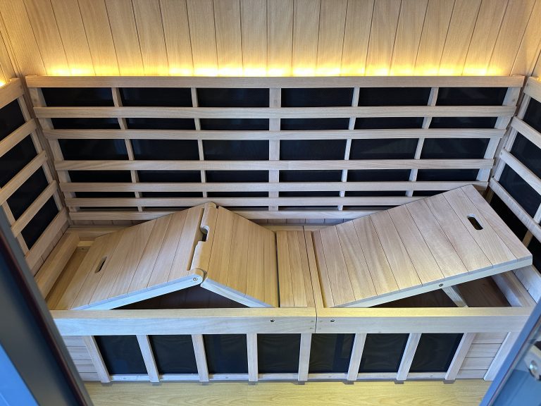 wooden sauna with two doors and a glowing light