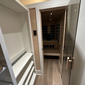 Closet with shelves and a closed door