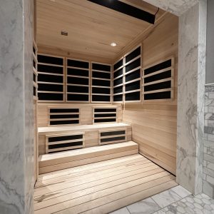Wooden-floored sauna with marble walls