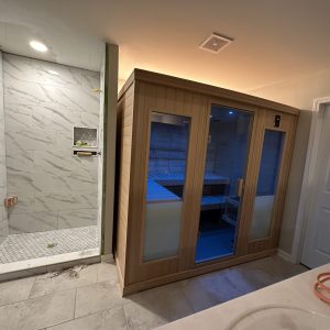spa-like bathroom with a sauna and a spacious shower