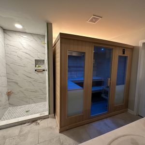 modern bathroom with a sauna and a glass-enclosed shower