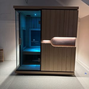 modern sauna with a glass door and soft lighting